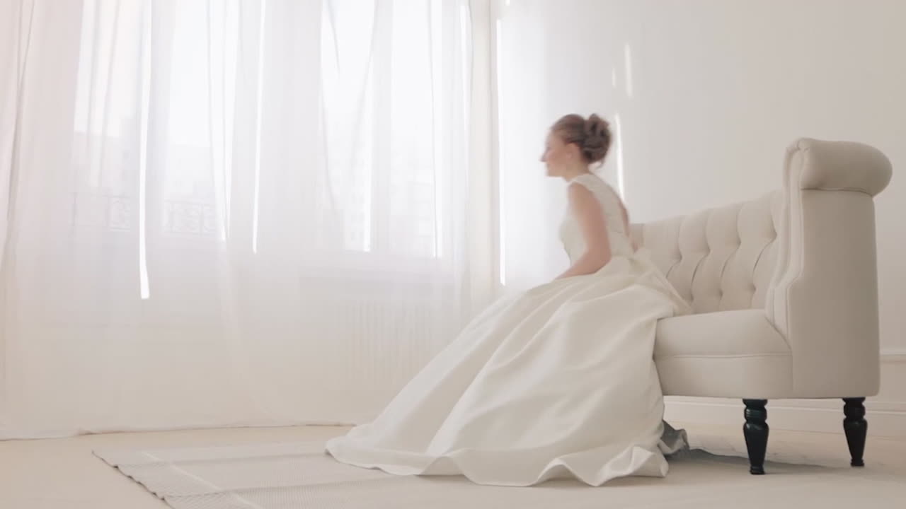 Bride in a White Dress by the Window