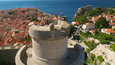 lowering aerial approach of a watch tower in the old town dubrovnik, croatia