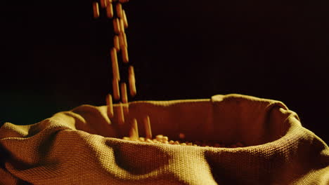 Soybeans pouring into a burlap sack