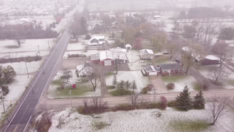 aerial view over rural southeast michigan as a snowstorm starts to take hold