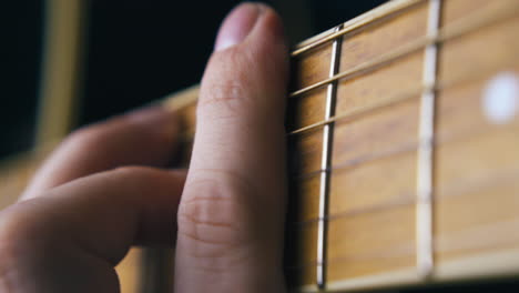 professional musician practices barre chord covering strings