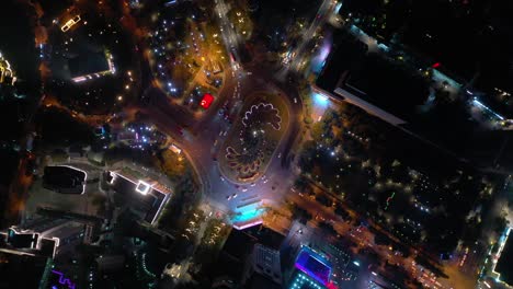 nanjing city night illuminated center traffic street circle park aerial topdown panorama 4k china