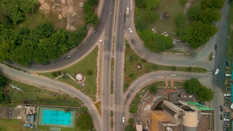 Traffic-and-cityscape-of-Victoria-Island,-Lagos,-Nigeria-featuring-Falomo-Bridge,-Lagos-Law-school-and-the-Civic-centre-tower