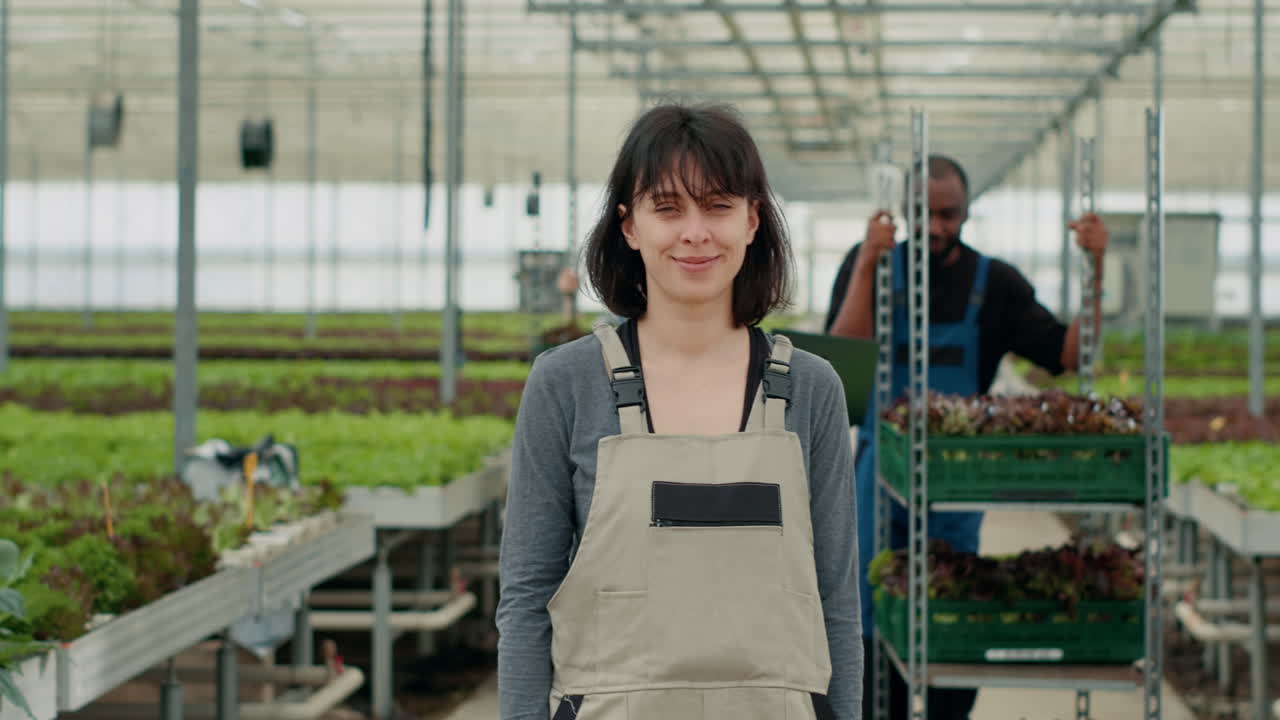 Farmers working in a greenhouse