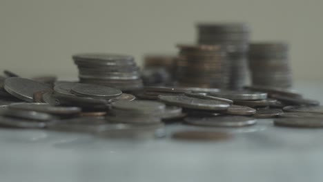 Focus-pulling-onto-various-stacks-of-coins