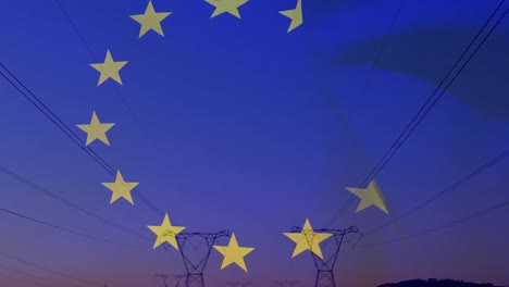 Animation-of-european-union-flag-over-electricity-pylons-in-field-at-sunset