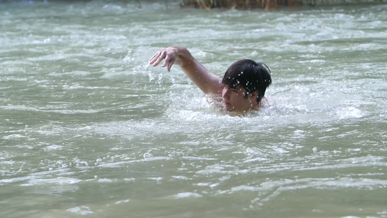 Asian Man Swim In Nature Swimming Pool, Slow Motion