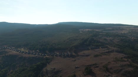 Drone-aerial-footage-of-a-Mountain-Lodge-Chalets-on-cliff-face