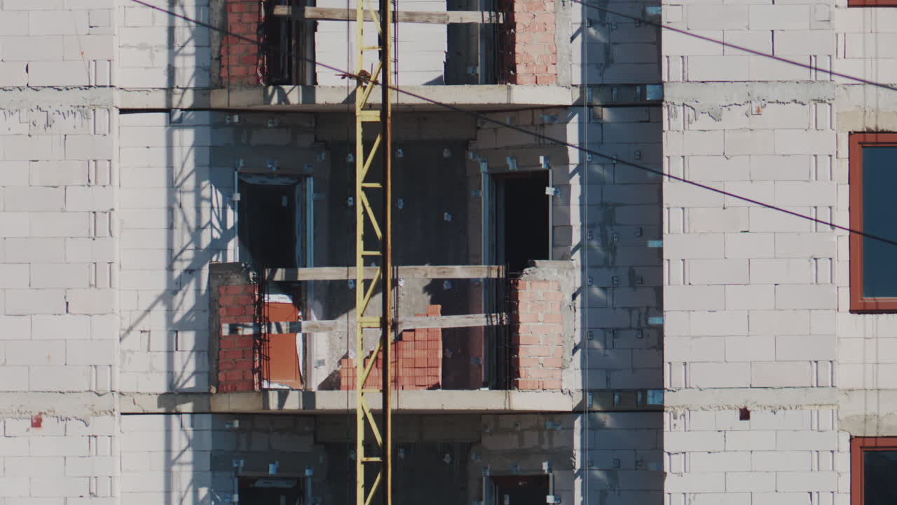 Close up of a building under construction with unfinished balcony and construction elements