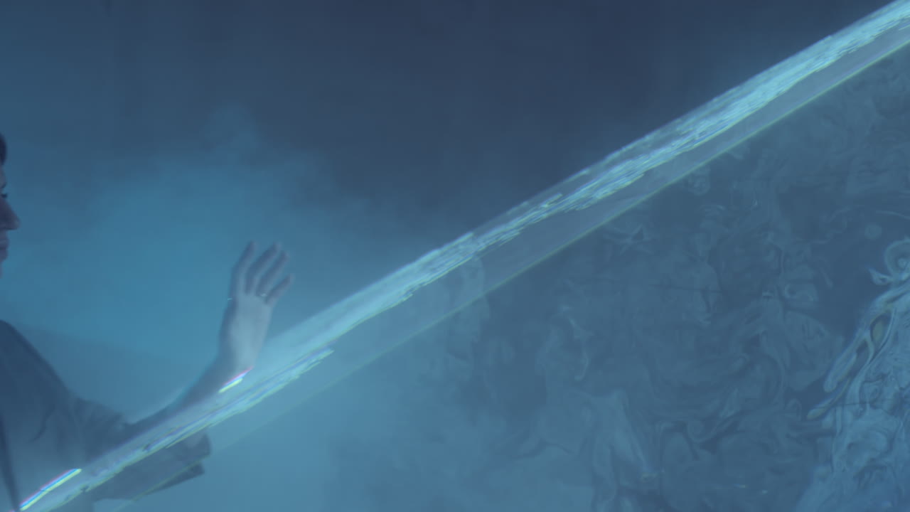 Woman Walking through Liquid Sky Laser Light in Dark Room