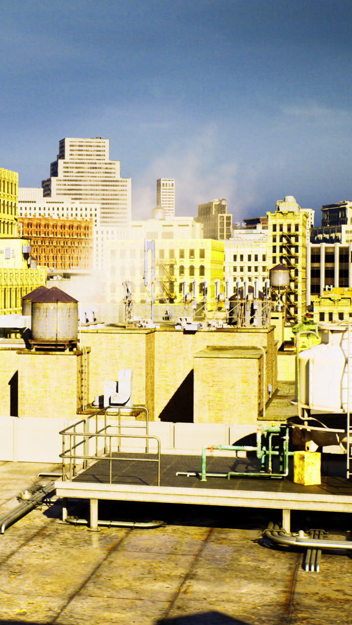 View of city rooftops with structures and equipment at sunset