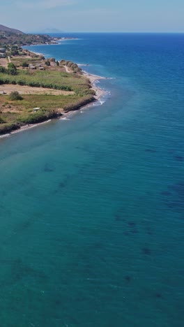 aerial view of a serene coastal landscape with clear blue waters