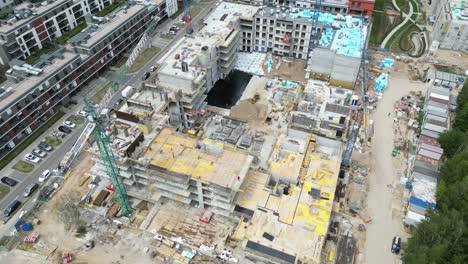 Aerial view of construction site with crane and building
