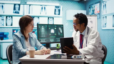 african american medic presenting the diagnostic reports to a female patient