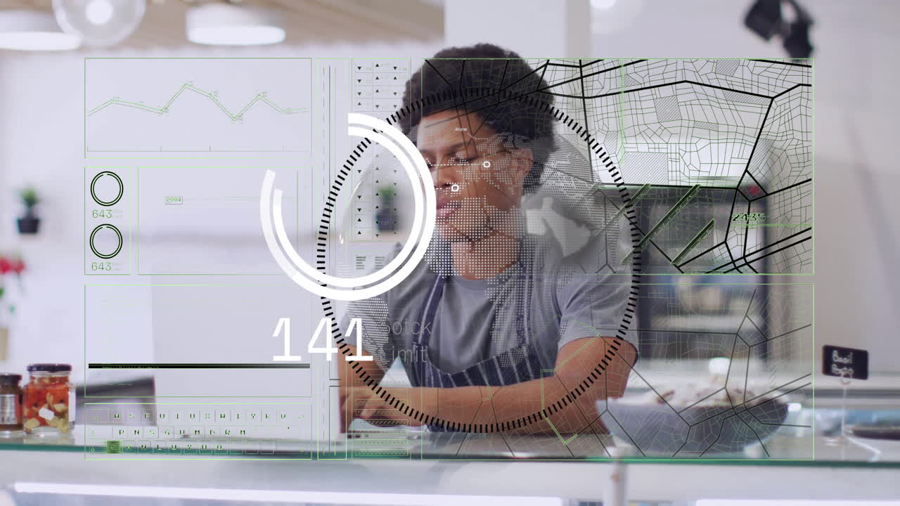 Animation of financial data processing over biracial barman using laptop in coffee shop