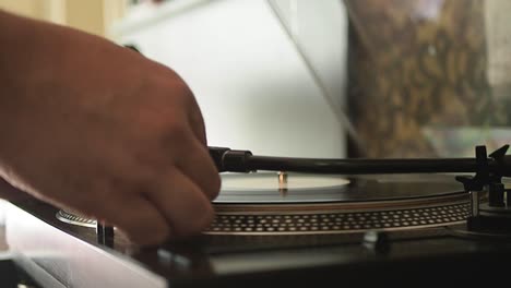 close up of the stylus getting put onto the record