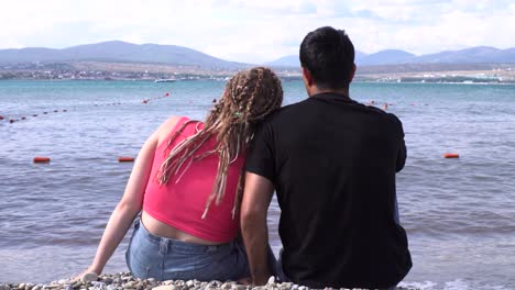 couple enjoying a romantic beach sunset