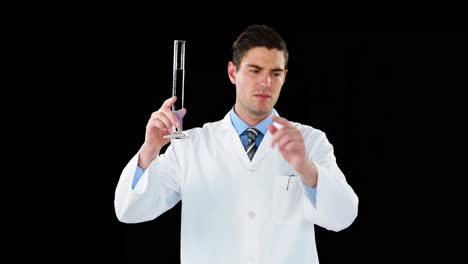 Doctor-using-digital-screen-while-examining-chemical-in-test-tube