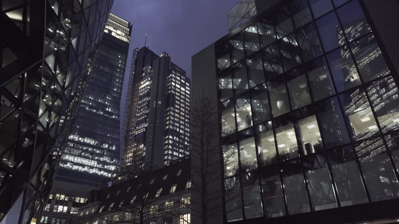 The Beautiful City Building Lights In London During The Evening - Tilt Up Shot