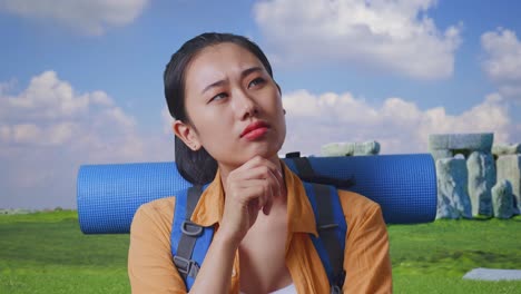close up of asian female hiker with mountaineering backpack thinking about something and looking around while traveling in stonehenge