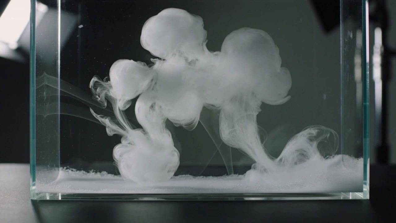 Forming white plume as pigment entering glass tank, dense fluid rising and spreading for study