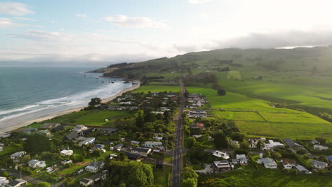 bay of huriawa historic site on a foggy day, peninsula located in new zealand, aerial drone distance view