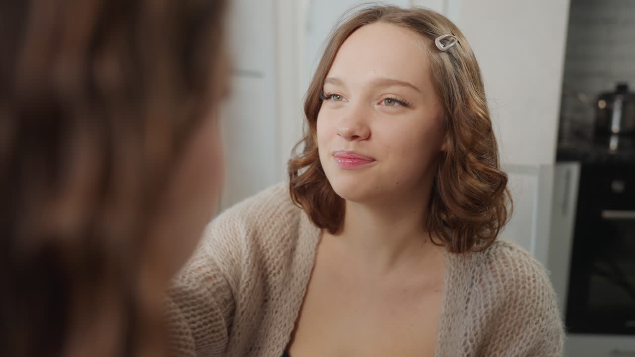 Caucasian Woman Applying Eyeshadow To Friend, Cozy Apartment Dressing Table, Soft Natural Light, Gentle Brush Strokes, Focused Expression, Makeup Brushes And Palette On Table, Quiet Bonding Moment
