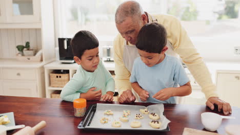 Grandfather-baking-cookies-with-his-grandchildren