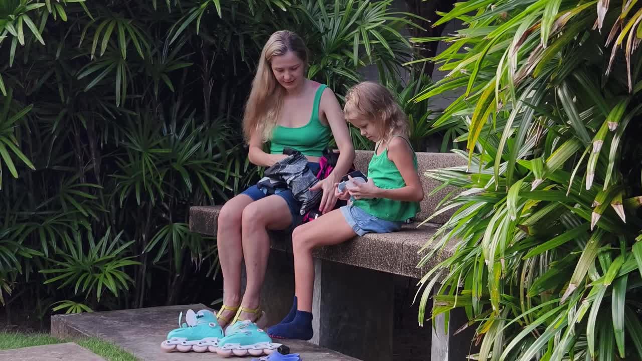 Mother and Daughter Getting Ready to Roller Skate