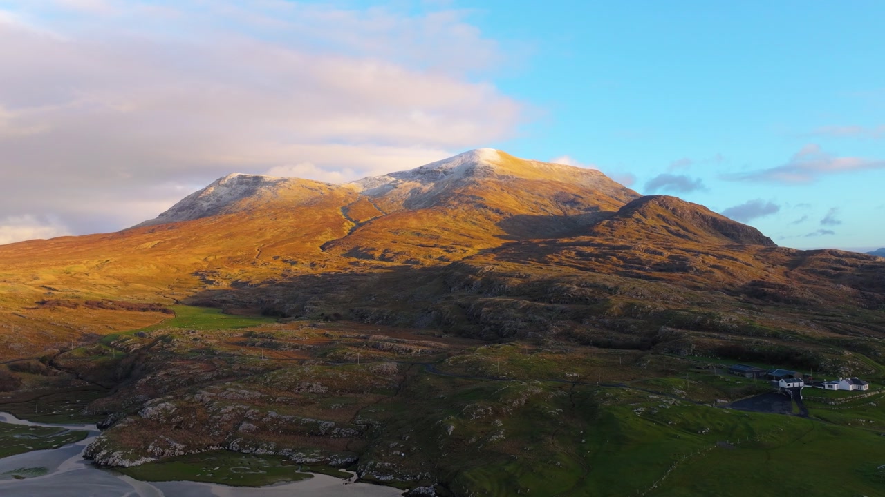 Golden sunlight illuminates rugged mountains and a sandy inlet in The Lost Valley, Ireland. Perfect for landscape features or travel content_02
