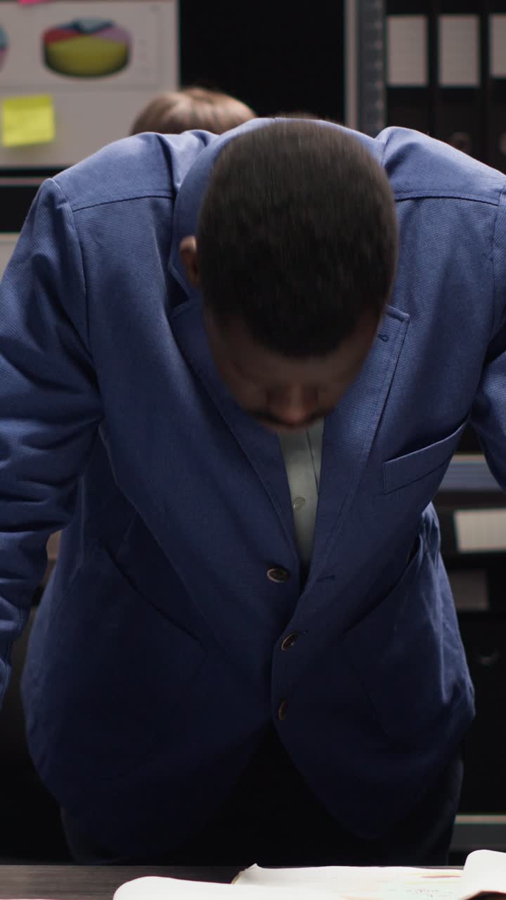 Professional African American man in suit working in office