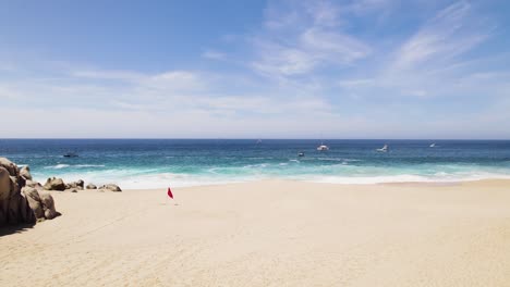 boats-on-the-horizon-line-on-the-coast-of-Cabo-San-Lucas,-Baja-California