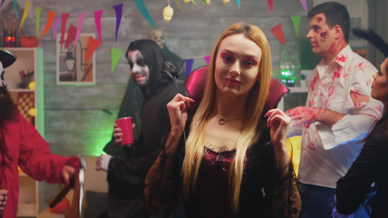 Sexy blonde in enchantress costume at halloween party