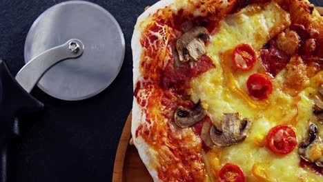 baked pizza on wooden board