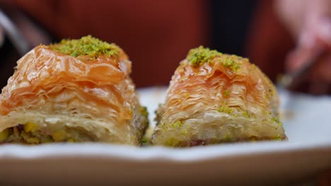 closeup of baklava with pistachios on a plate