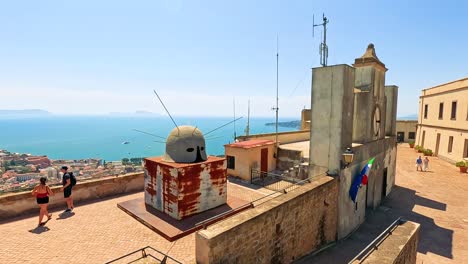 tourists enjoy views from historic naples lookout