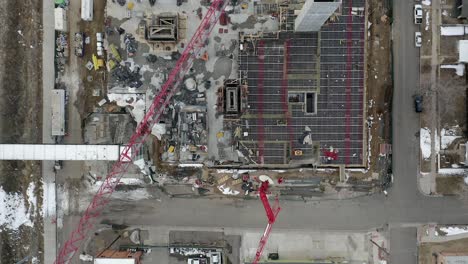 aerial high top view of a crane and building construction