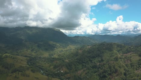 drone aerial landscape view of green mountains during a beautiful day in guatemala