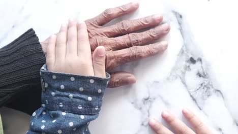 grandparent and grandchild holding hands