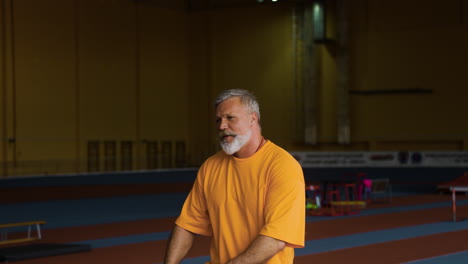 senior and young man greeting each other indoors