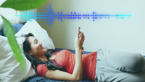 animation of data processing over happy asian woman using smartphone