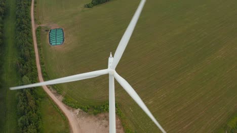 Aerial-top-down,-downward-view-of-a-rotating-wind-turbine