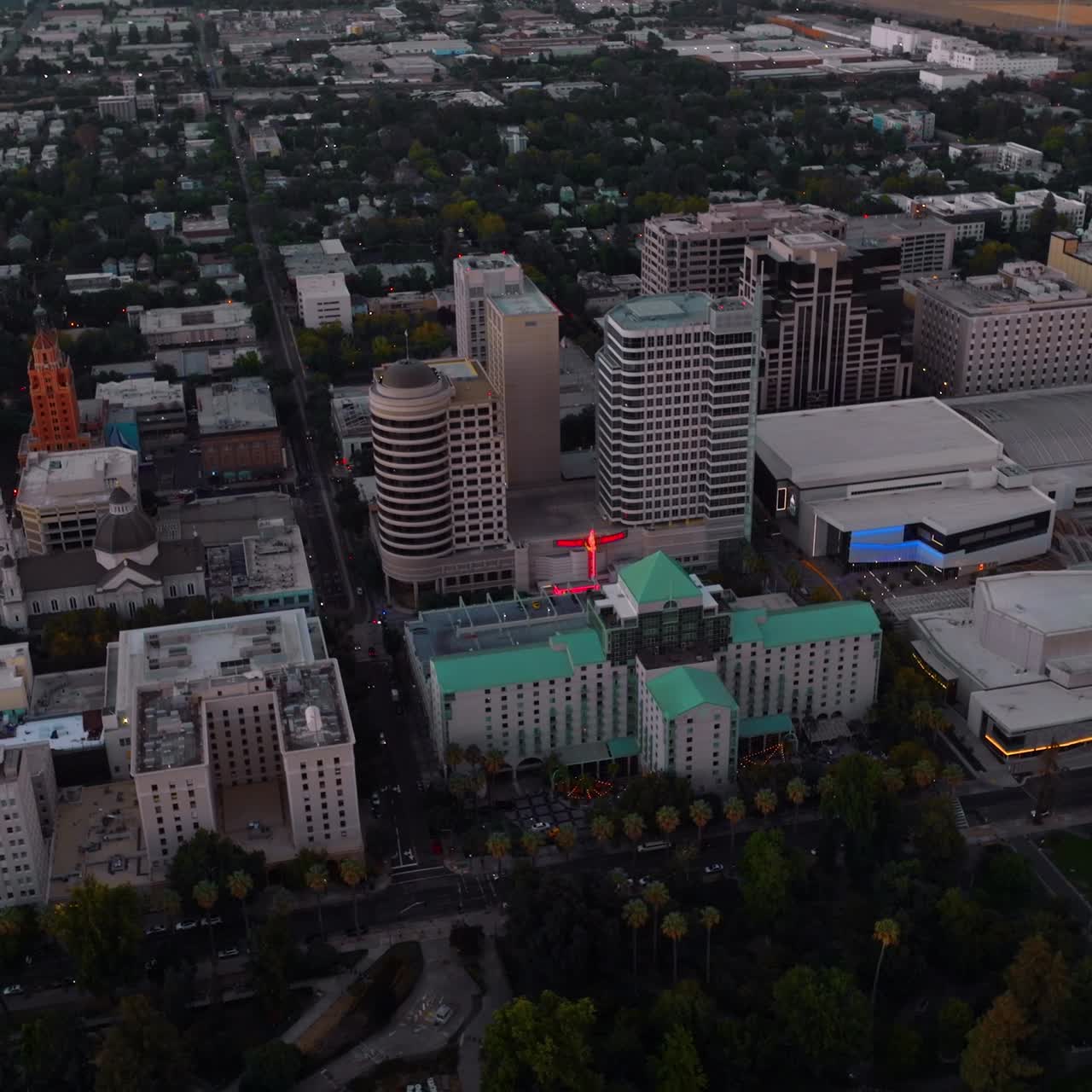 Multi-storied contemporary buildings in Sacramento downtown. Evening footage from drone