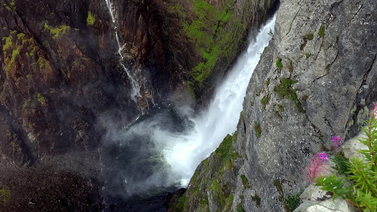 Slow motion scene of Voringsfossen in Hardangervidda, Norway, with spray, rocks and dramatic cliffs