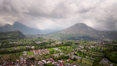 houses and farmlands near mount batur in bali, indonesia