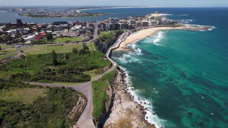aerial shot of newcastle beach with newcastle ocean baths in nsw, australia