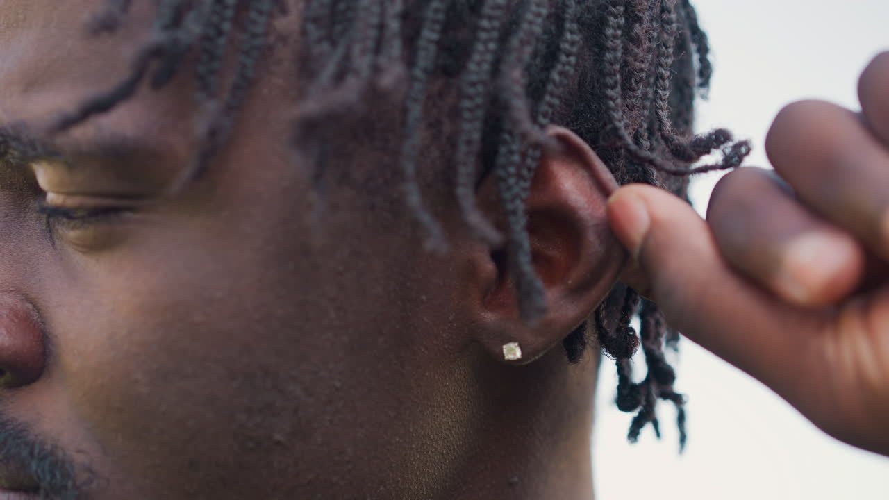 Leader Reviews Accessories Calmly, Uniformed Sergeant Carefully Checks His Stud Earring Attentively, Sharpdressed Military Sergeant Ensures His Stud Earring Is Properly In Place Before Duty