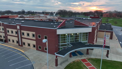 school in usa with american flag