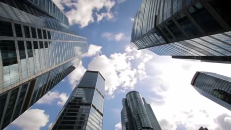 a stunning view of modern skyscrapers against a bright blue sky, capturing the essence of urban architecture and the beauty of city life in a mesmerizing perspective