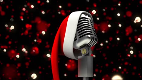 Animation-of-glowing-red-lights-over-microphone-with-christmas-hat-on-dark-background